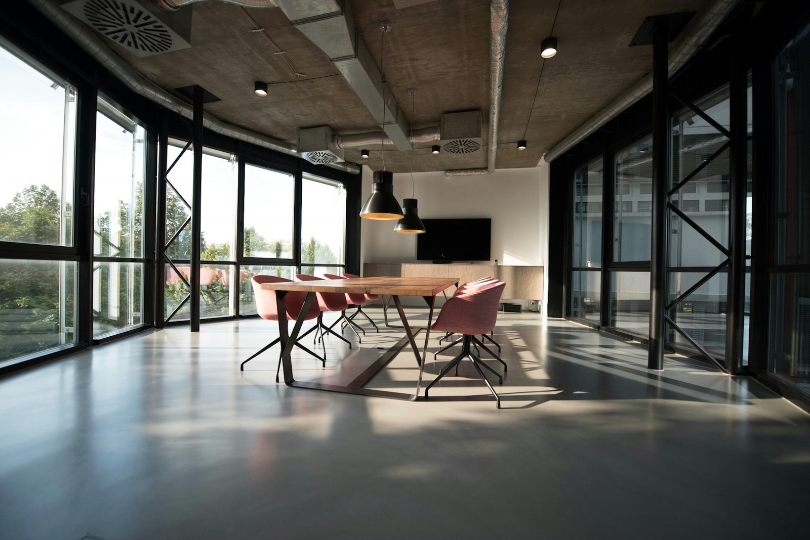 Supportive office chair at a compact desk in a shared apartment room.